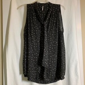 Free People black sleeveless blouse with deep V neckline with tie